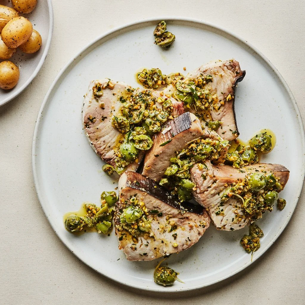 Swordfish Steaks with OlivePistachio Sauce and Potatoes