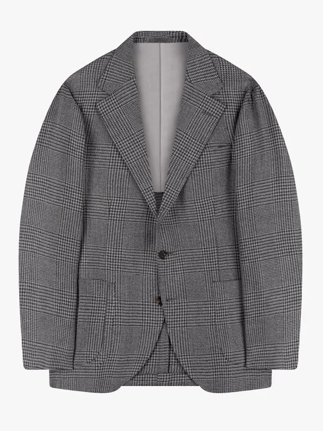 Image may contain Blazer Clothing Coat Jacket Formal Wear and Suit