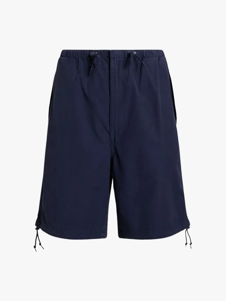 Image may contain Clothing Shorts Skirt and Swimming Trunks