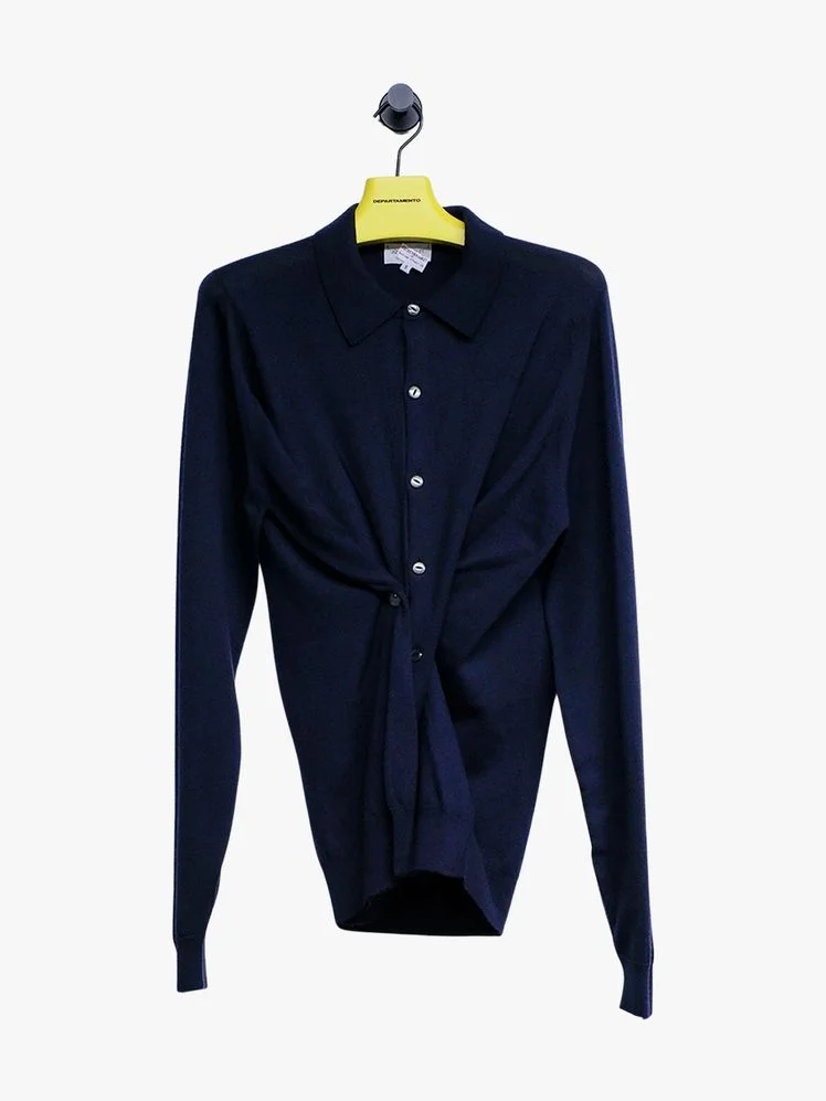 Image may contain Blazer Clothing Coat Jacket Long Sleeve Sleeve Shirt Knitwear Sweater Formal Wear and Suit