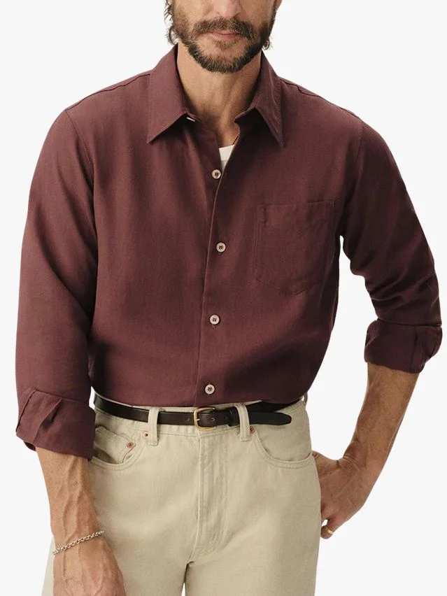 Image may contain Clothing Shirt Dress Shirt Long Sleeve and Sleeve