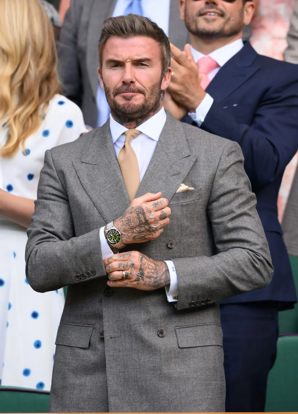 Image may contain David Beckham Clothing Formal Wear Suit Adult Person Child Applause Blazer Coat Jacket and Face