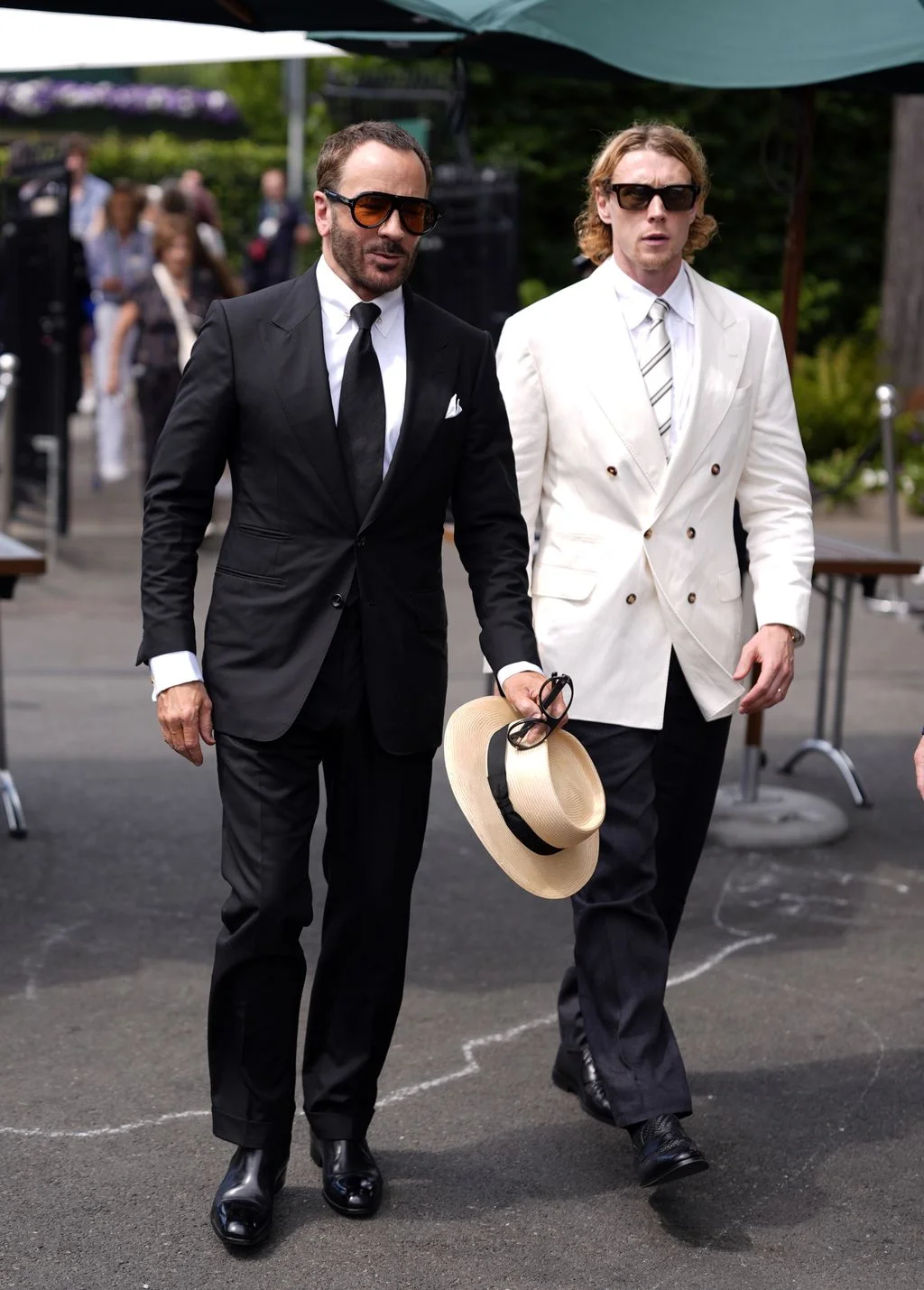 Image may contain Tom Ford George MacKay Jonathan Cyprien Clothing Formal Wear Suit Person Walking and Pedestrian