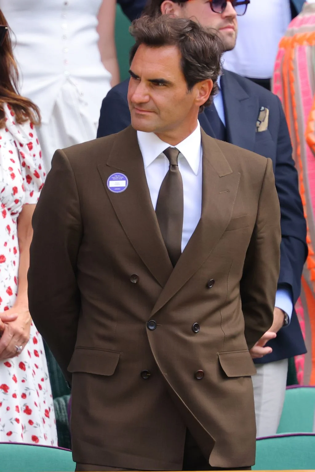 Image may contain Roger Federer Clothing Formal Wear Suit Coat Blazer Jacket Accessories Tie Tuxedo and Adult