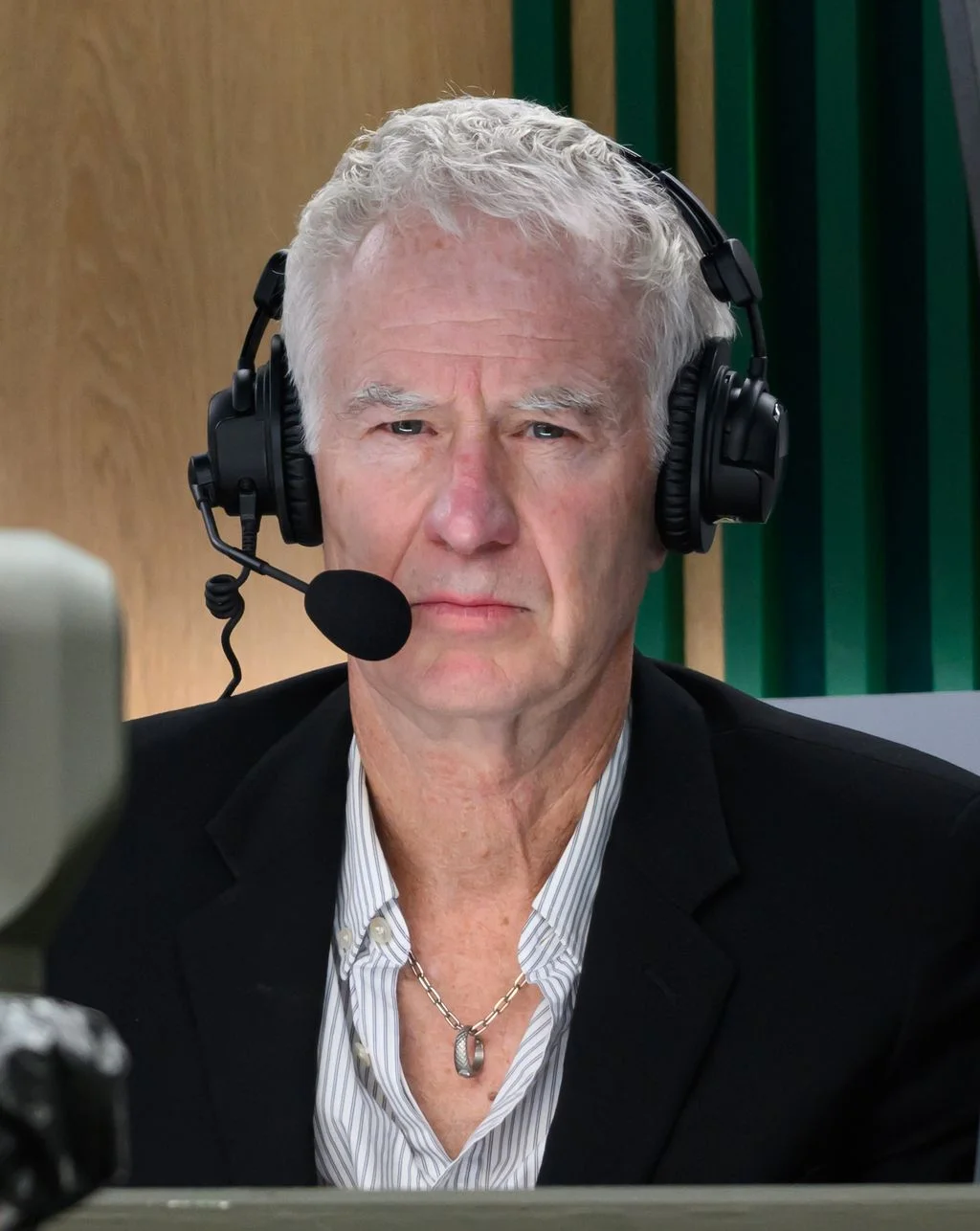 Image may contain John McEnroe Electronics Headphones Adult Person Face Head Photography Portrait Blonde and Hair