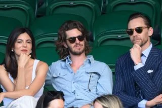 LONDON ENGLAND JULY 04 Monica Barbaro Andrew Garfield and Tom Hiddleston during day six of the 2026 Wimbledon Tennis...