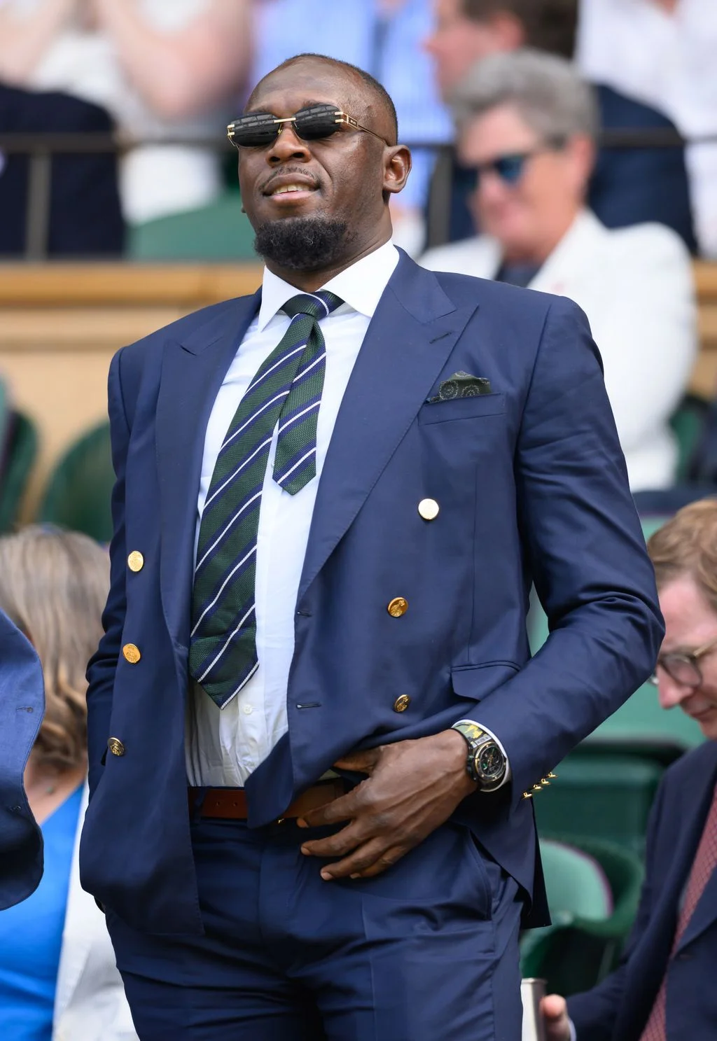 Image may contain Usain Bolt Philipp Lengsfeld Blazer Clothing Coat Jacket Accessories Formal Wear Tie and Adult