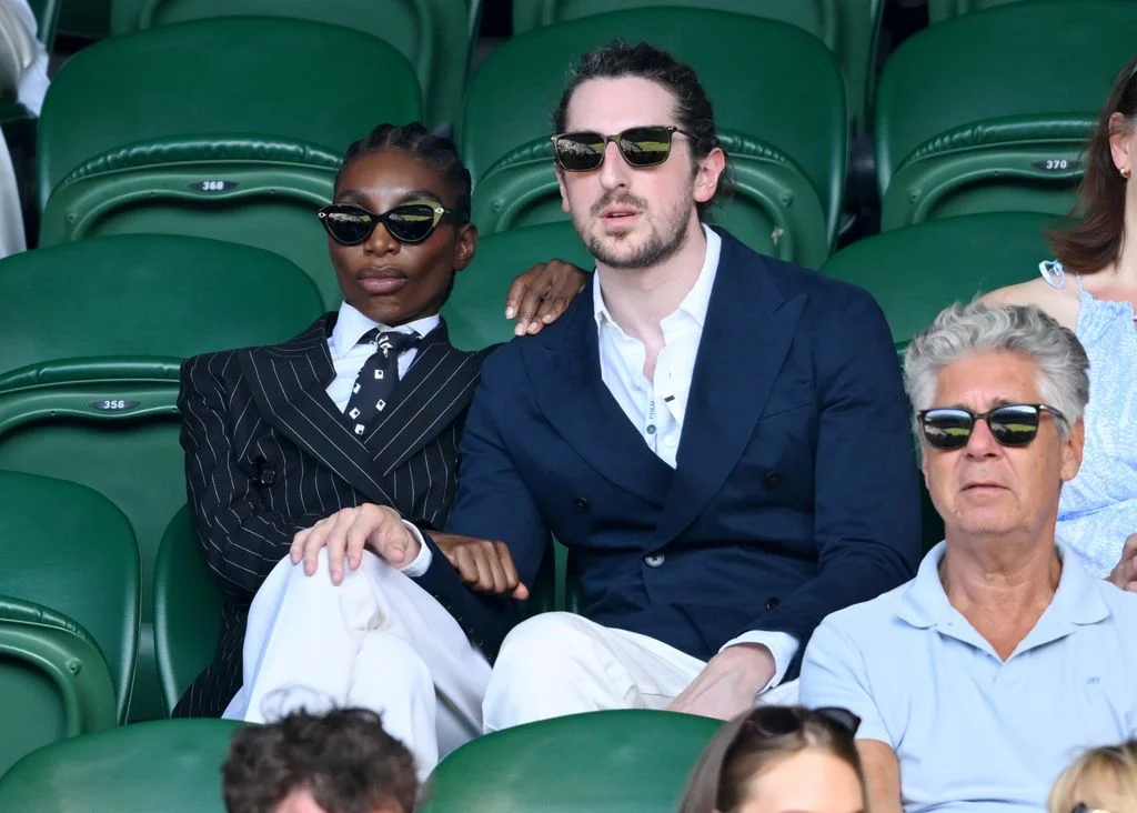 Image may contain Michaela Coel Accessories Sunglasses Blazer Clothing Coat Jacket Formal Wear Suit and People
