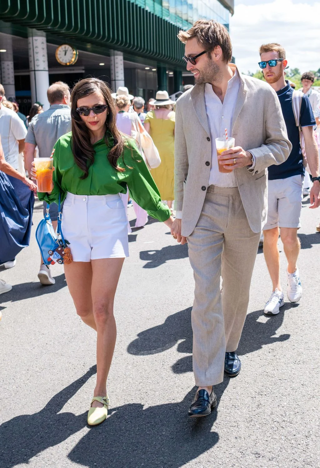 Image may contain Douglas Booth Bel Powley Iwan Roberts Adult Person Clothing Shorts Body Part Hand Coat and Pants