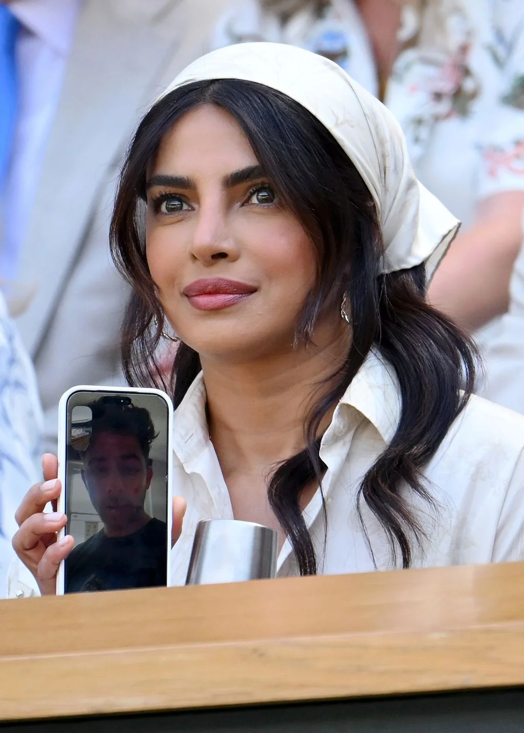 Image may contain Priyanka Chopra Nick Jonas Head Person Face Happy Smile Photography Adult and Electronics