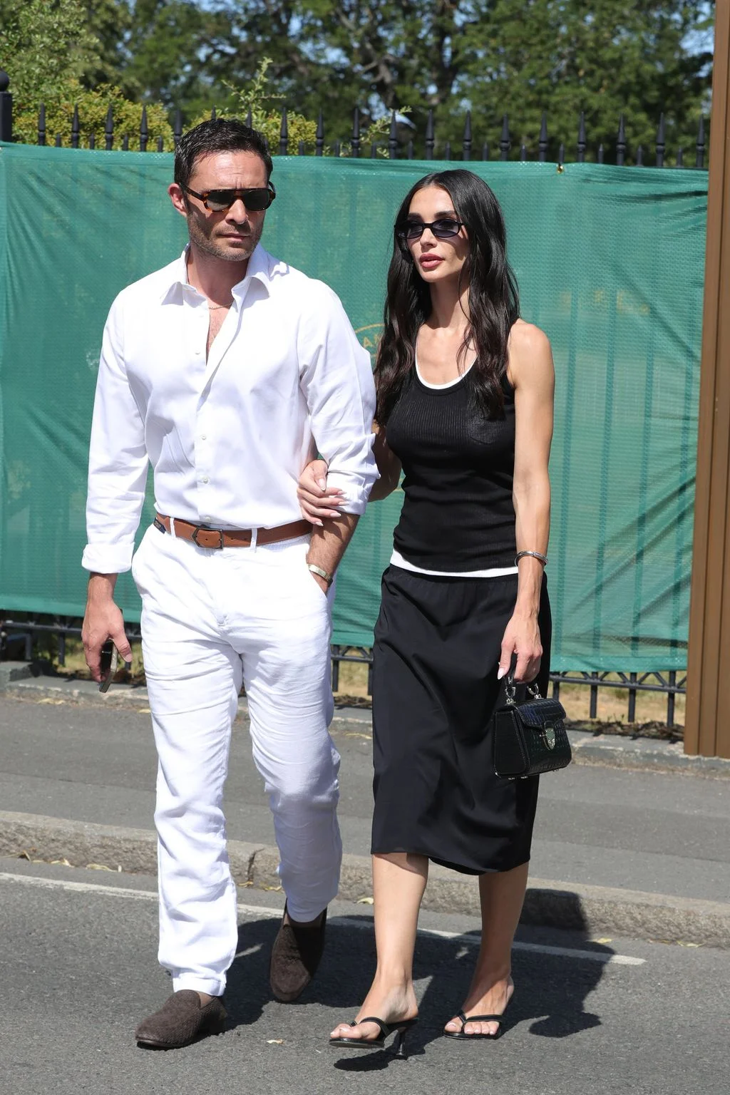 Image may contain Ed Westwick Maldonado Amy Jackson Adult Person Accessories Belt Body Part Hand Bag and Handbag