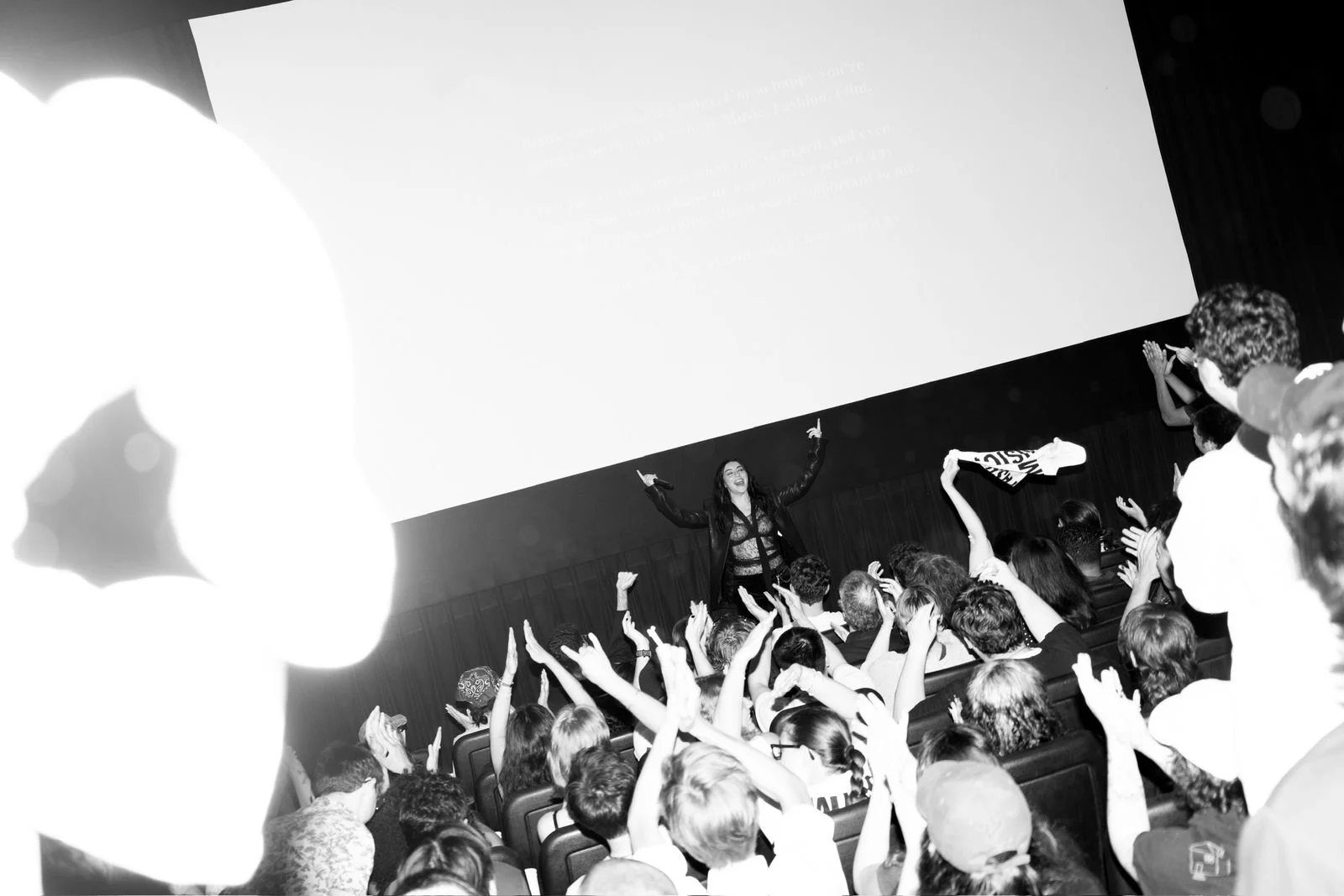 Image may contain Concert Crowd Person Urban People Adult Wedding Lighting Accessories and Glasses
