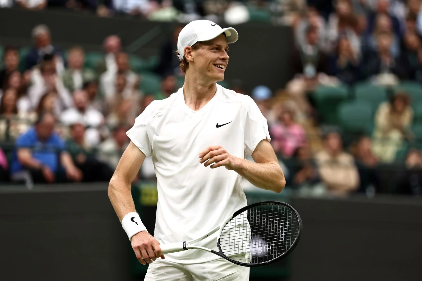 Image may contain Stephen Huss Racket Sport Tennis Tennis Racket Adult Person Baseball Cap Cap Clothing and Hat