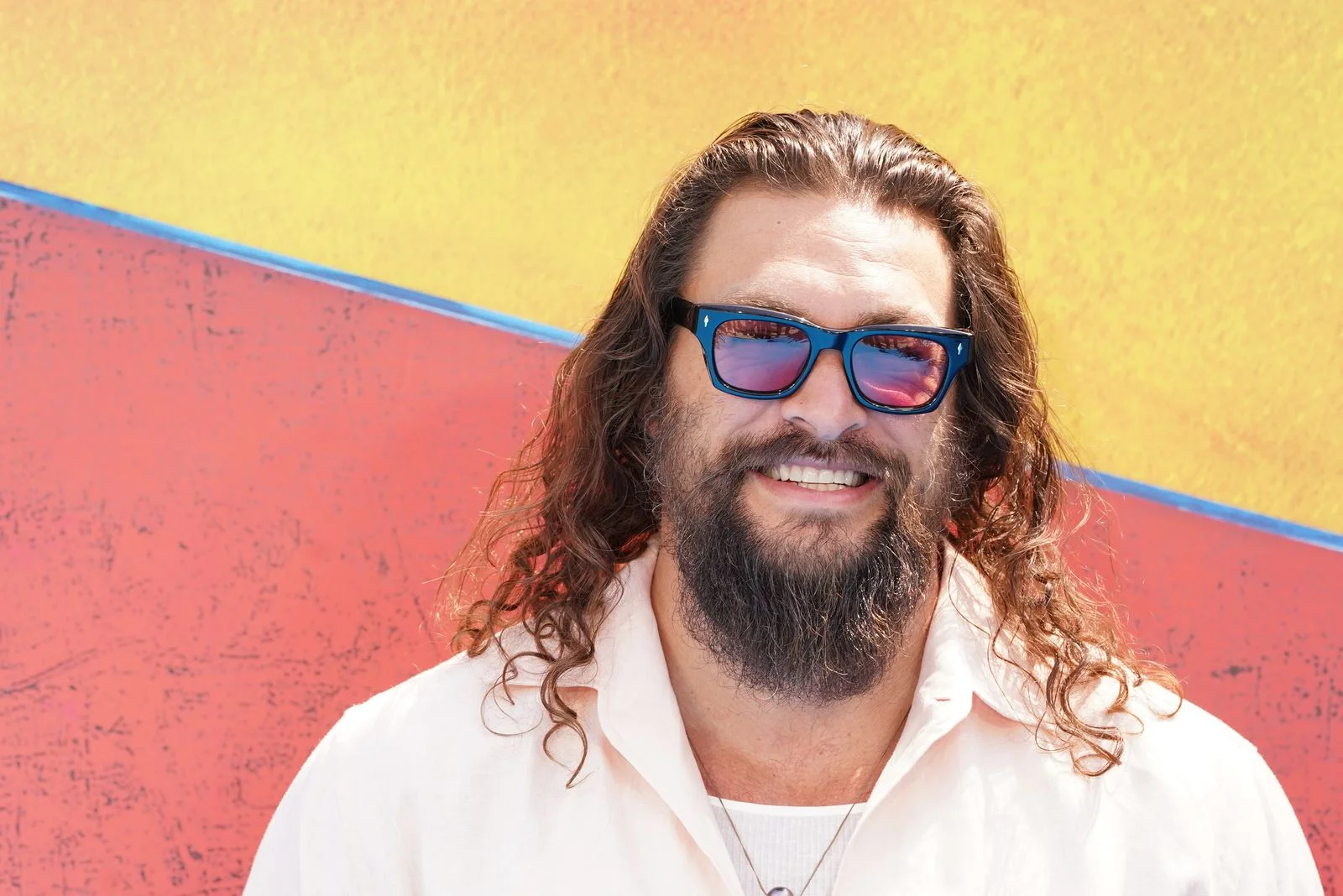 Image may contain Jason Momoa Accessories Sunglasses Head Person Face Adult Happy Smile Beard and Photography