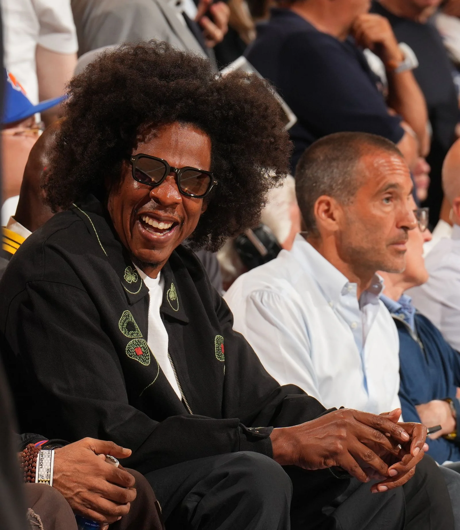 Image may contain JayZ Face Head Person Happy Adult Laughing Accessories and Glasses