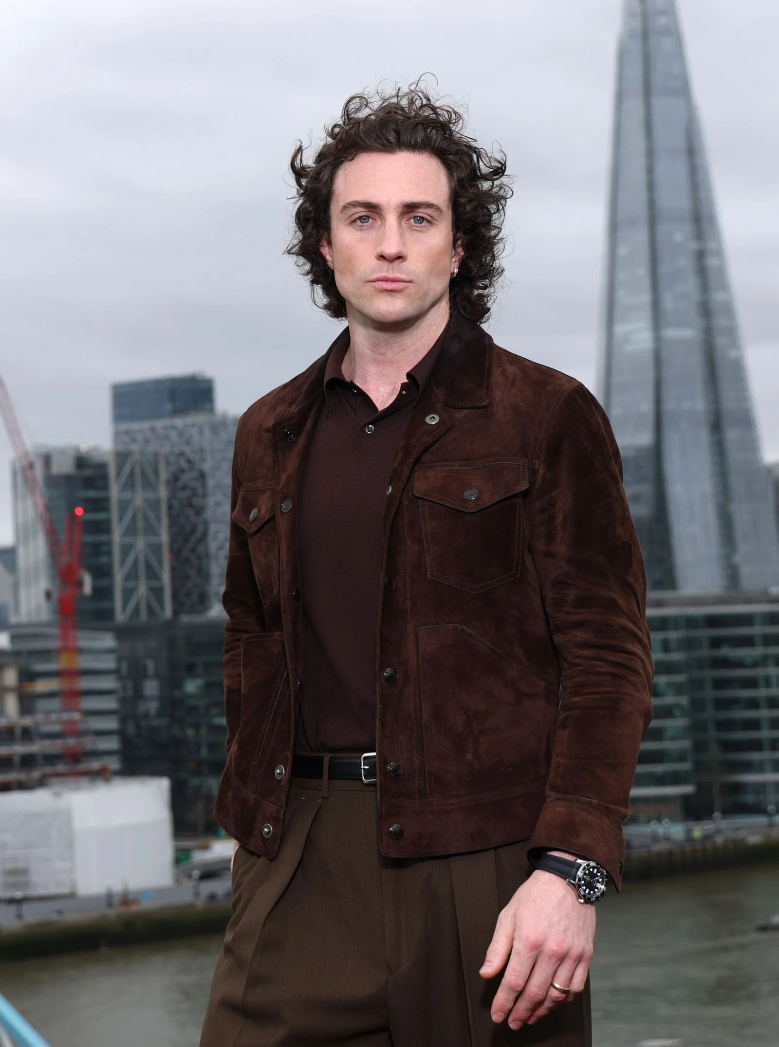Image may contain Aaron Altaras Clothing Coat Jacket Face Head Person Photography Portrait Adult and Wristwatch