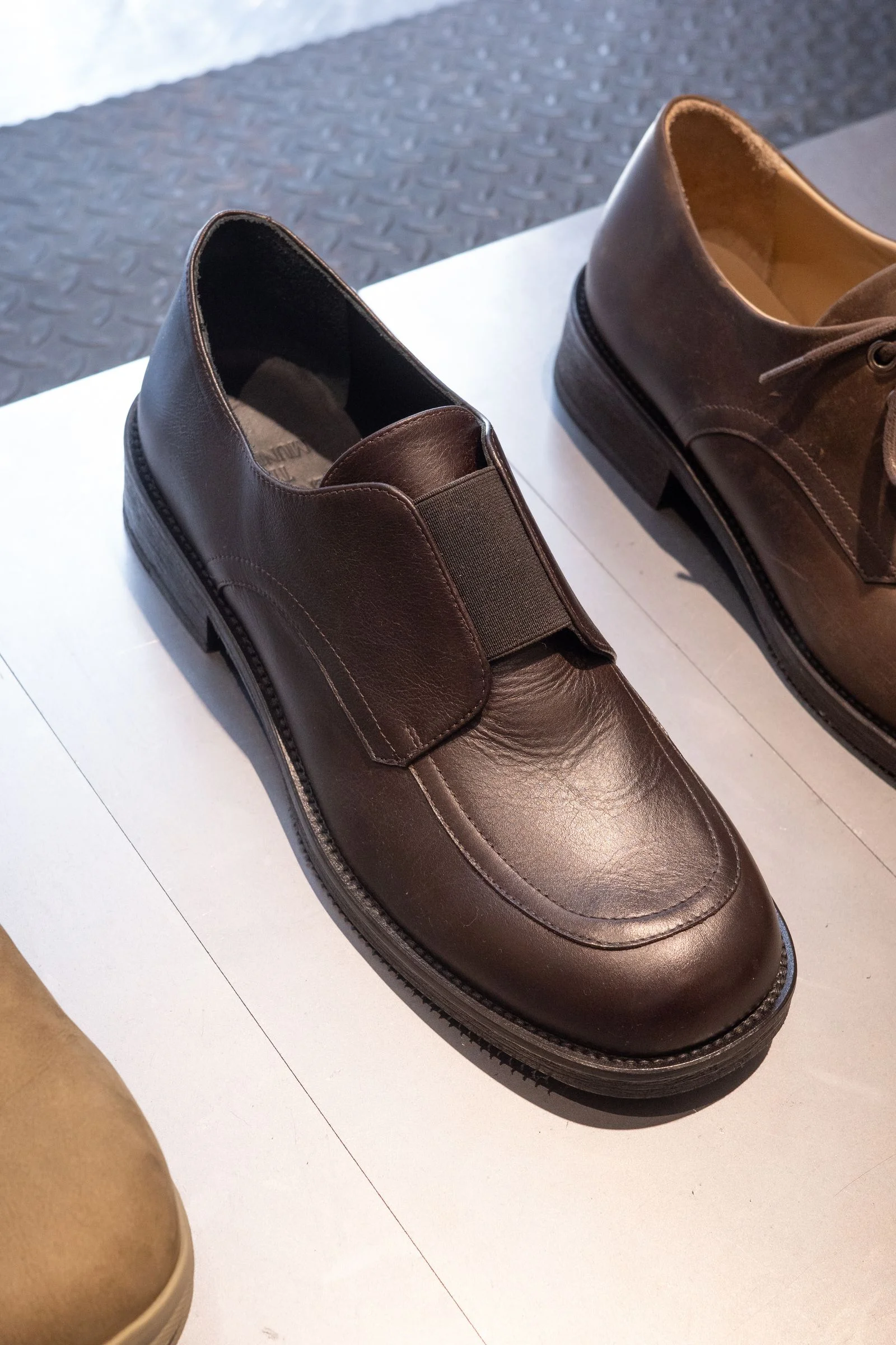 A pair of brown loafers