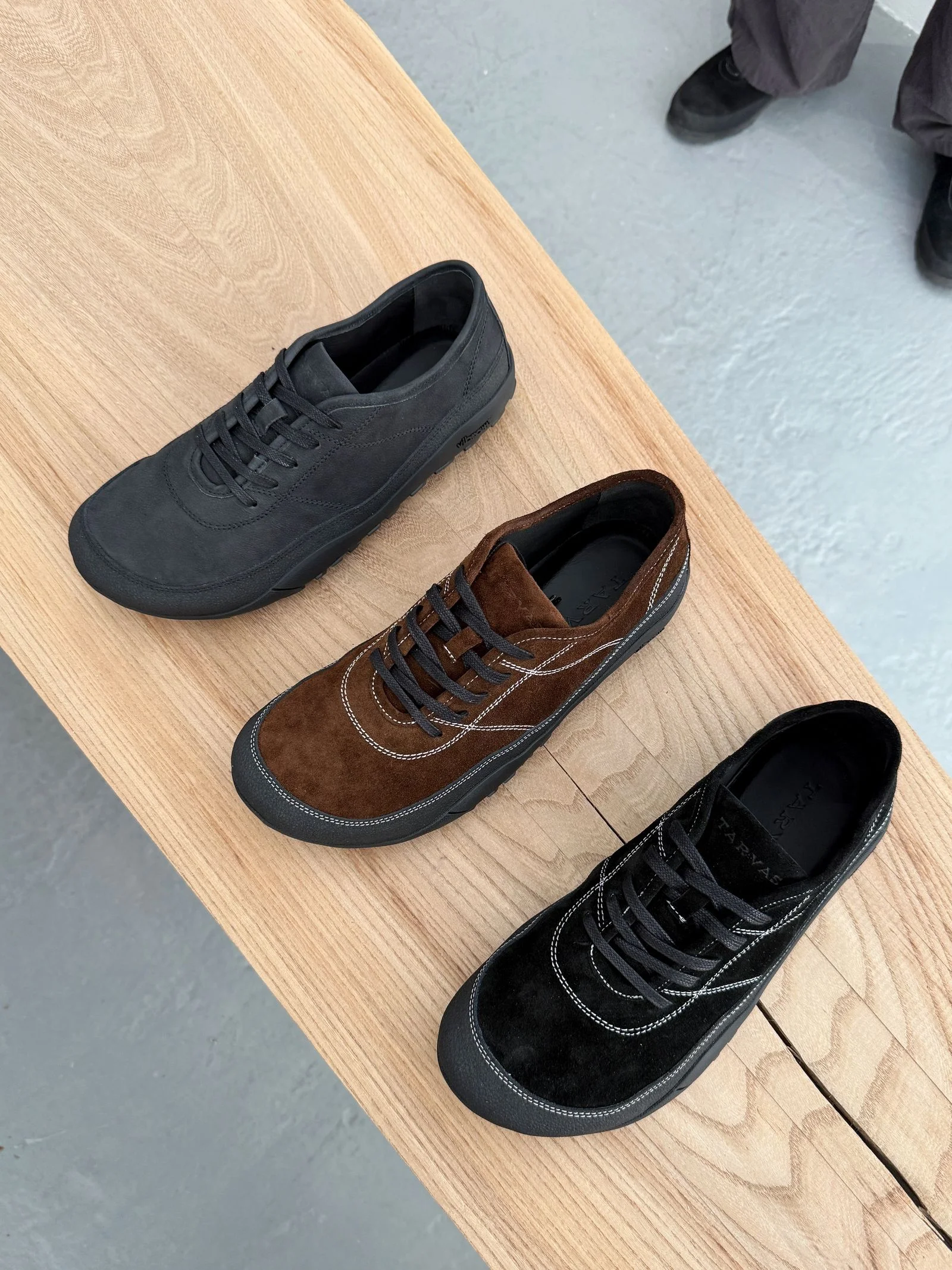 Three different sneakers lined up in a row