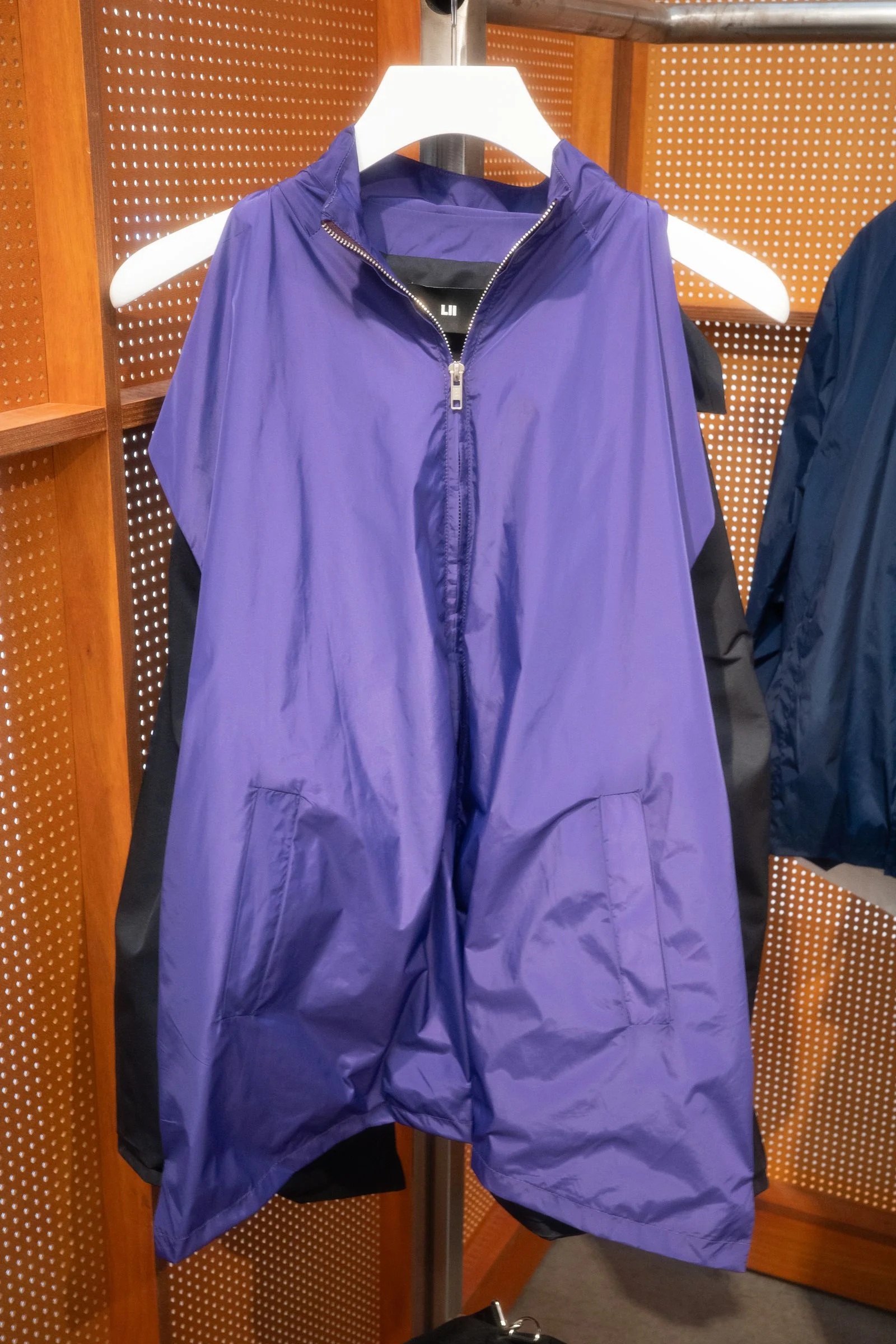 A purple sleeveless windbreaker
