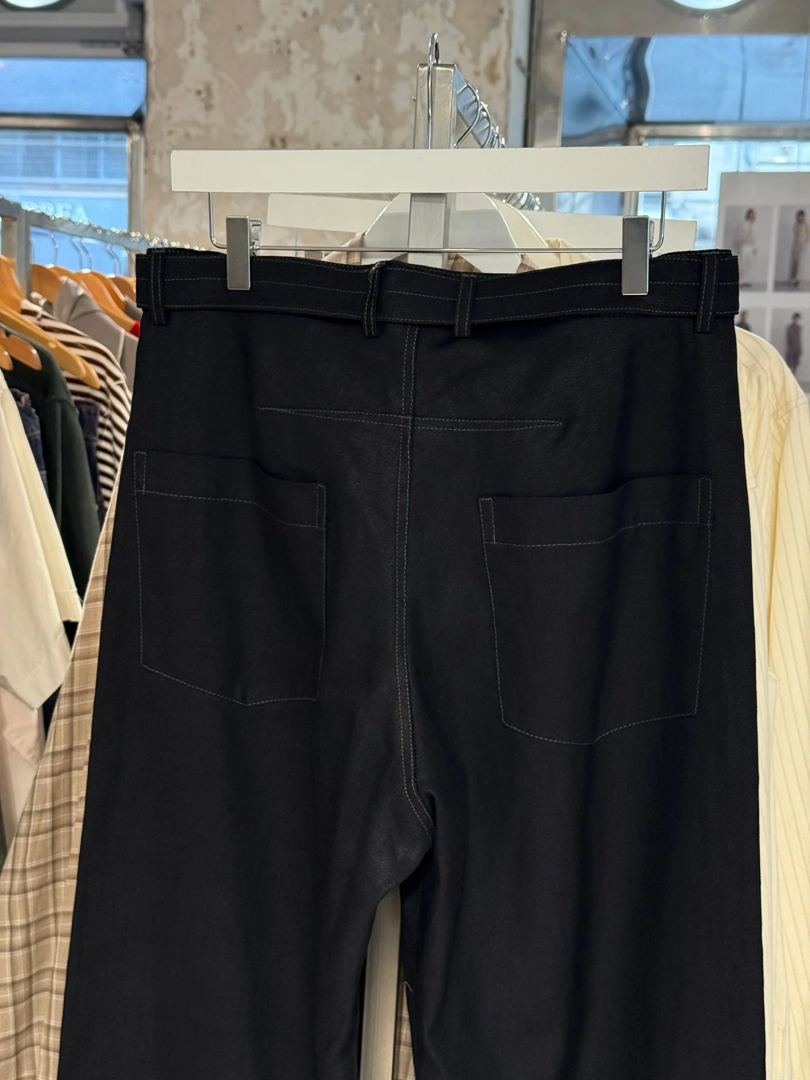 A closeup of the same pair of black pants
