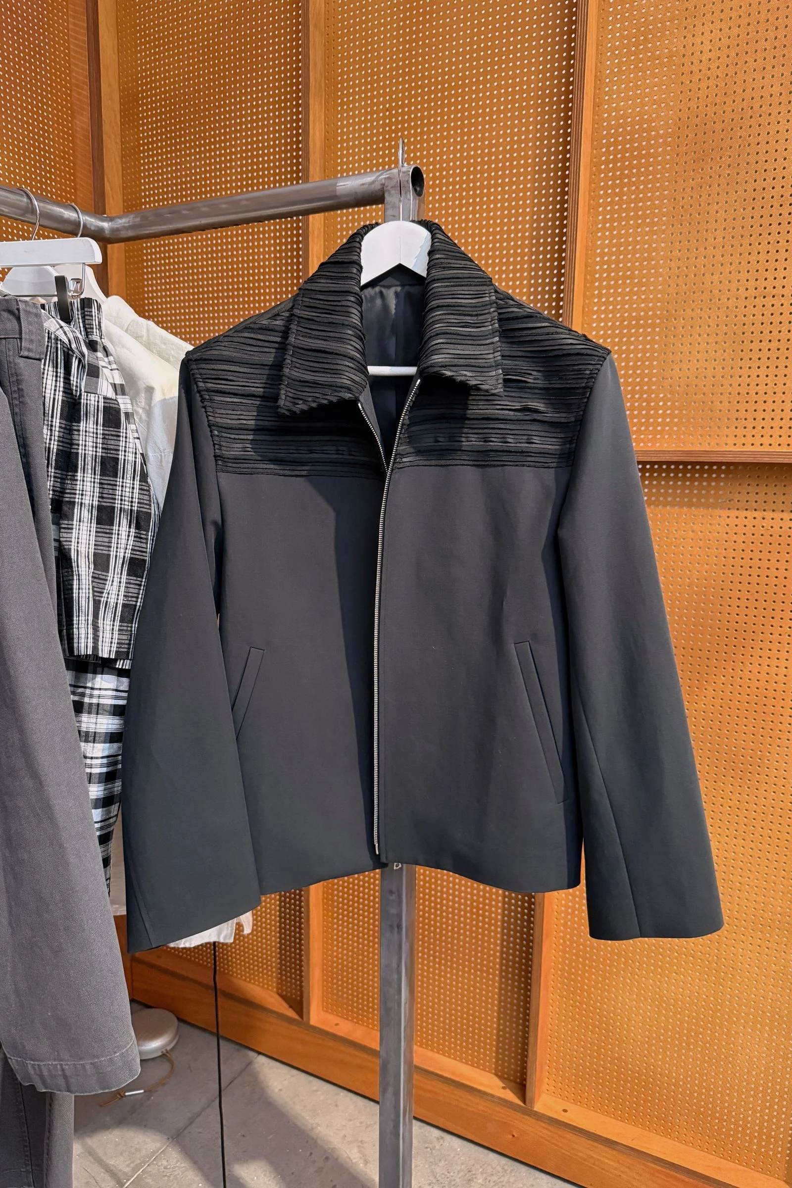A black jacket with an intricately designed collar