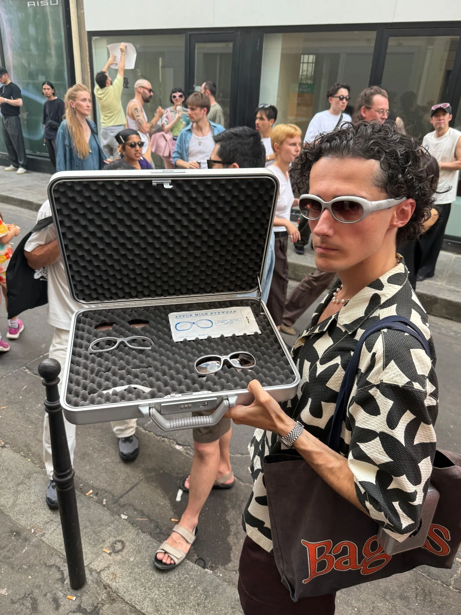 Apple Milk founder Leo showing off a briefcase with sunglasses hidden inside