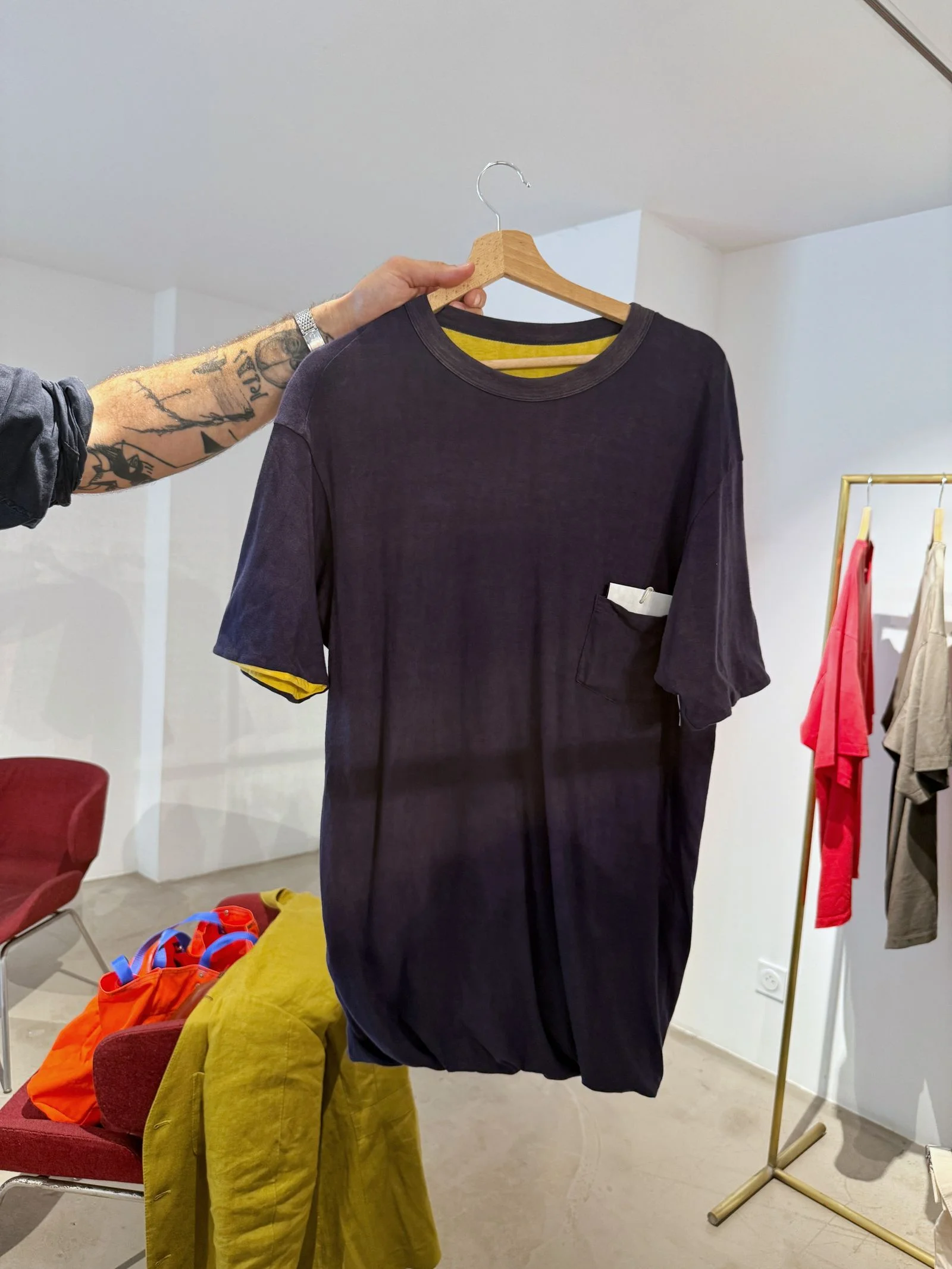 A black tshirt on a hanger