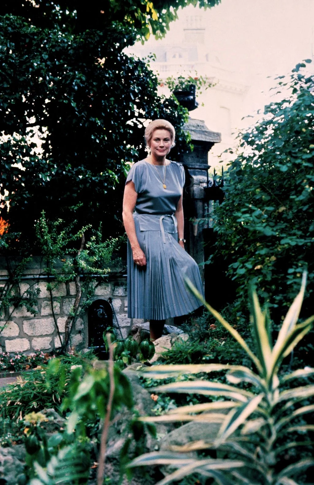 Image may contain Grace Kelly Adult Person Clothing Skirt Standing Accessories Jewelry and Necklace