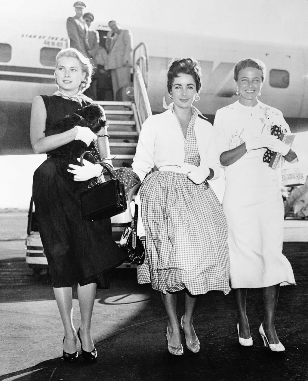 Image may contain Grace Kelly Elizabeth Taylor Laraine Day Kate Beaton Accessories Bag Handbag Person and Clothing