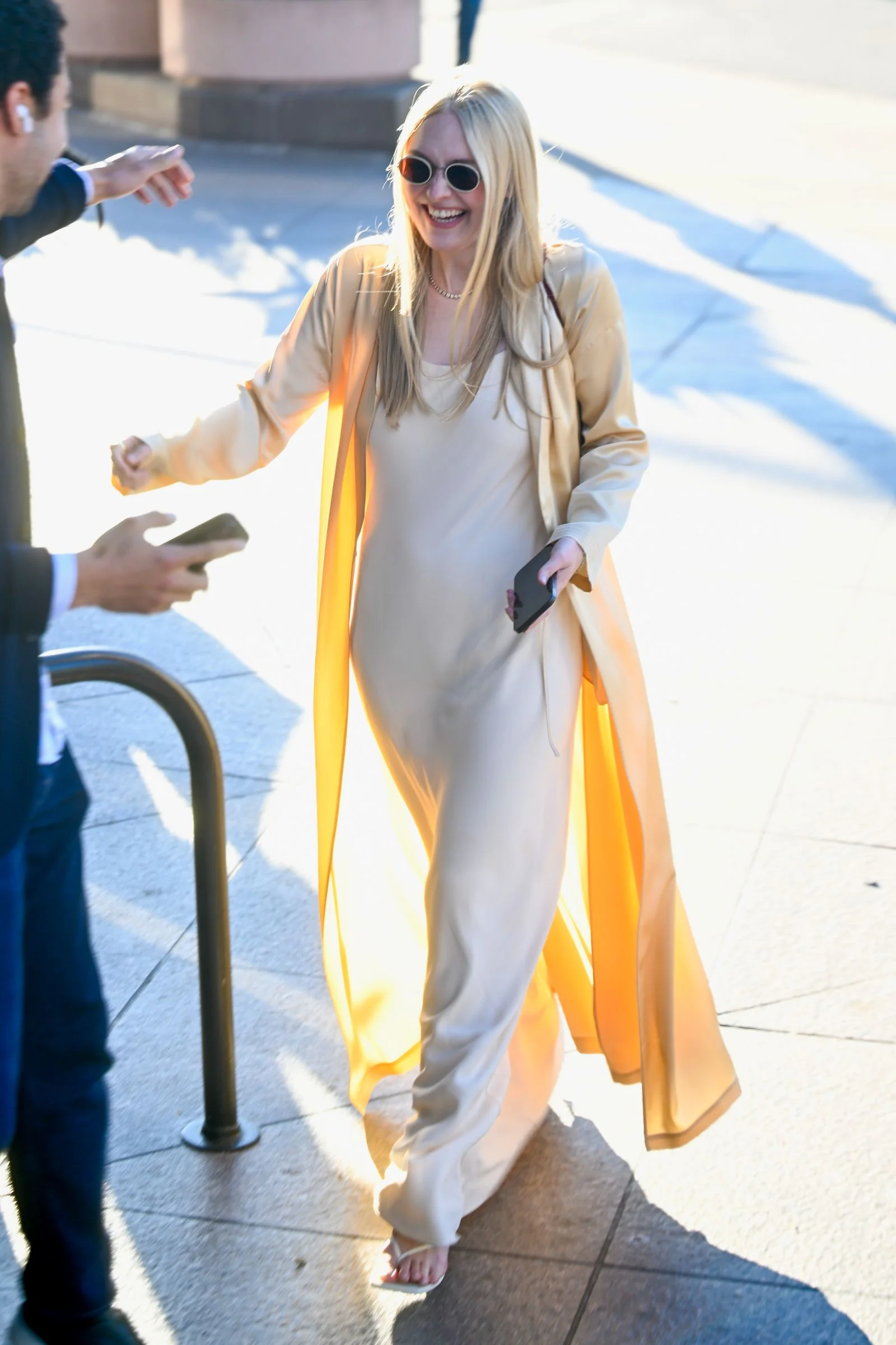 Image may contain Dakota Fanning Face Head Person Adult Blonde Hair Body Part Hand Accessories and Glasses