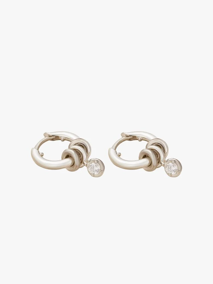 Image may contain: Accessories, Earring, Jewelry, Diamond, and Gemstone