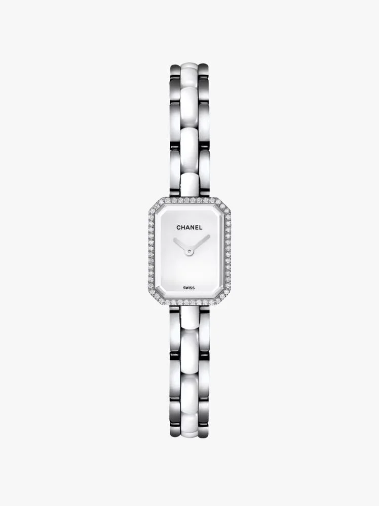 Image may contain: Wristwatch, Arm, Body Part, Person, and Smoke Pipe