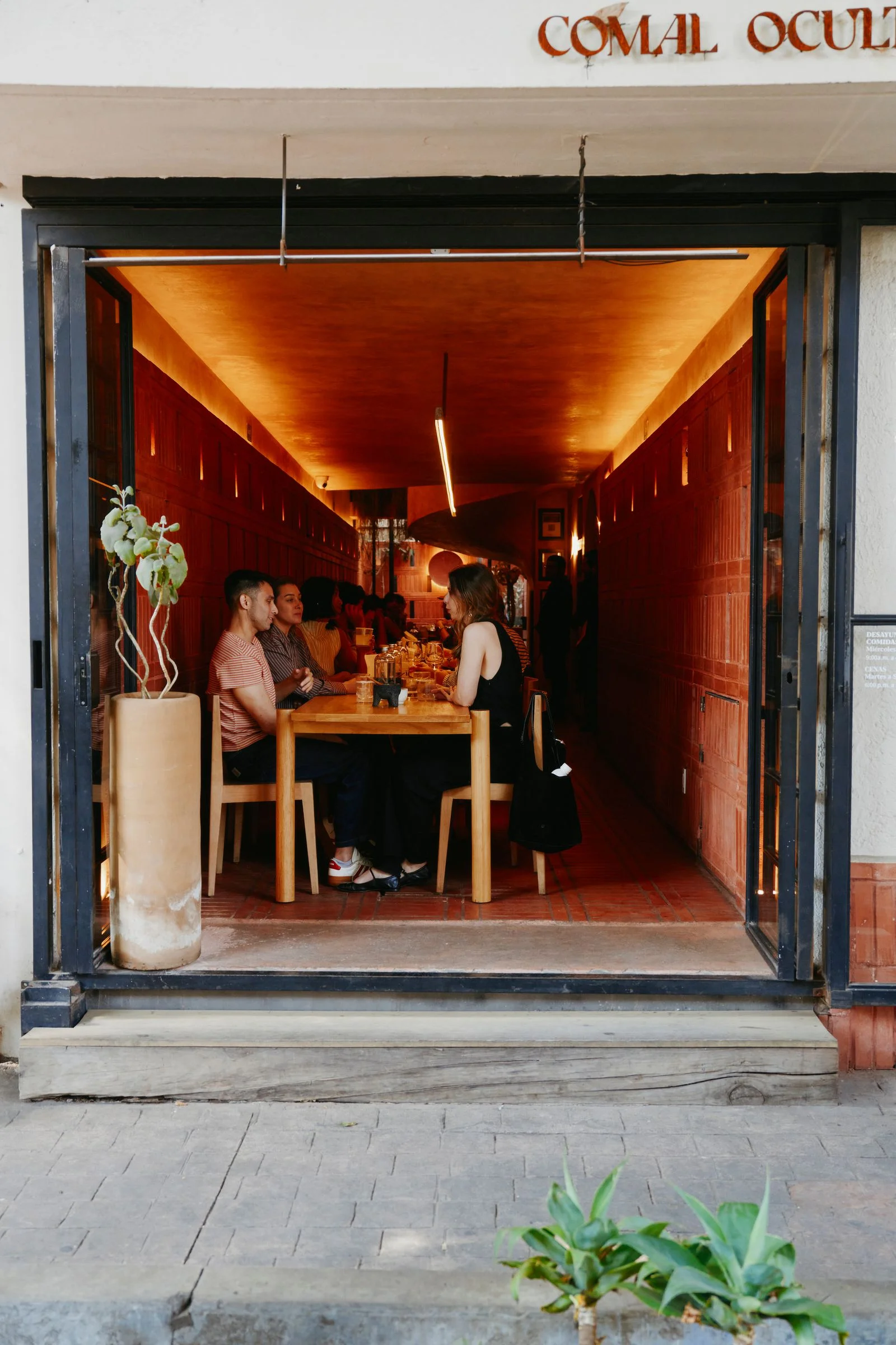 Image may contain Cafe Indoors Restaurant Dining Table Furniture Table Architecture and Building