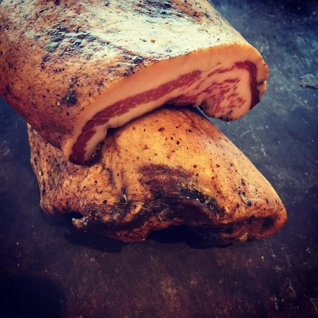 Product shot of smoking goose guanciale