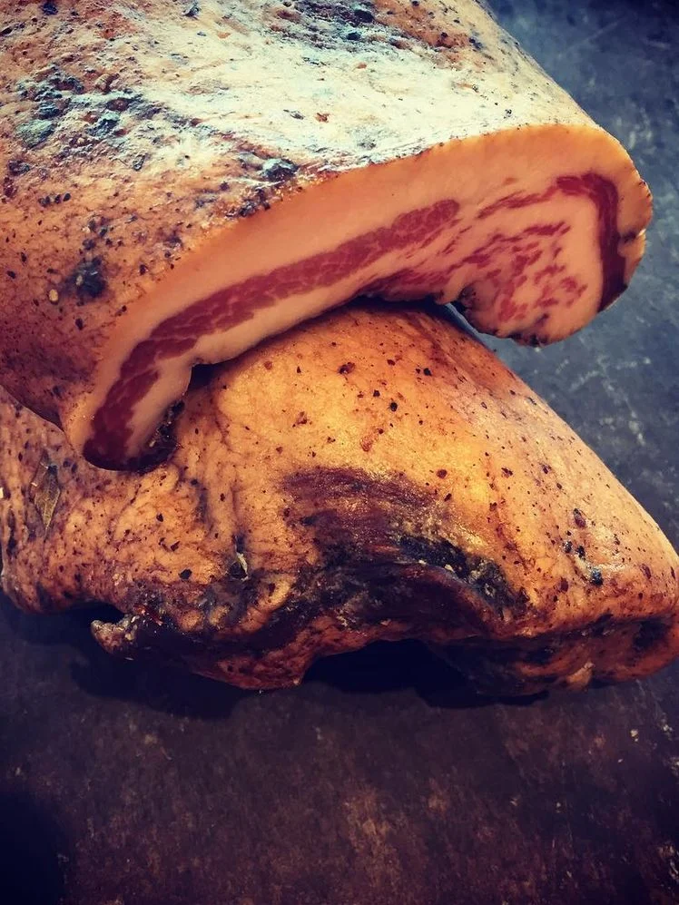 Product shot of smoking goose guanciale