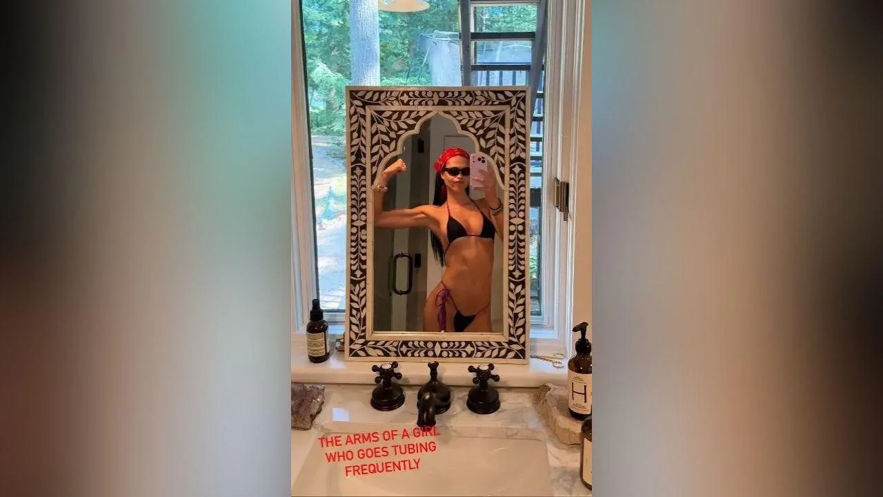 image of Amelia Hamlin wore a red head bandana and black G-string bikini during her lakeside getaway.