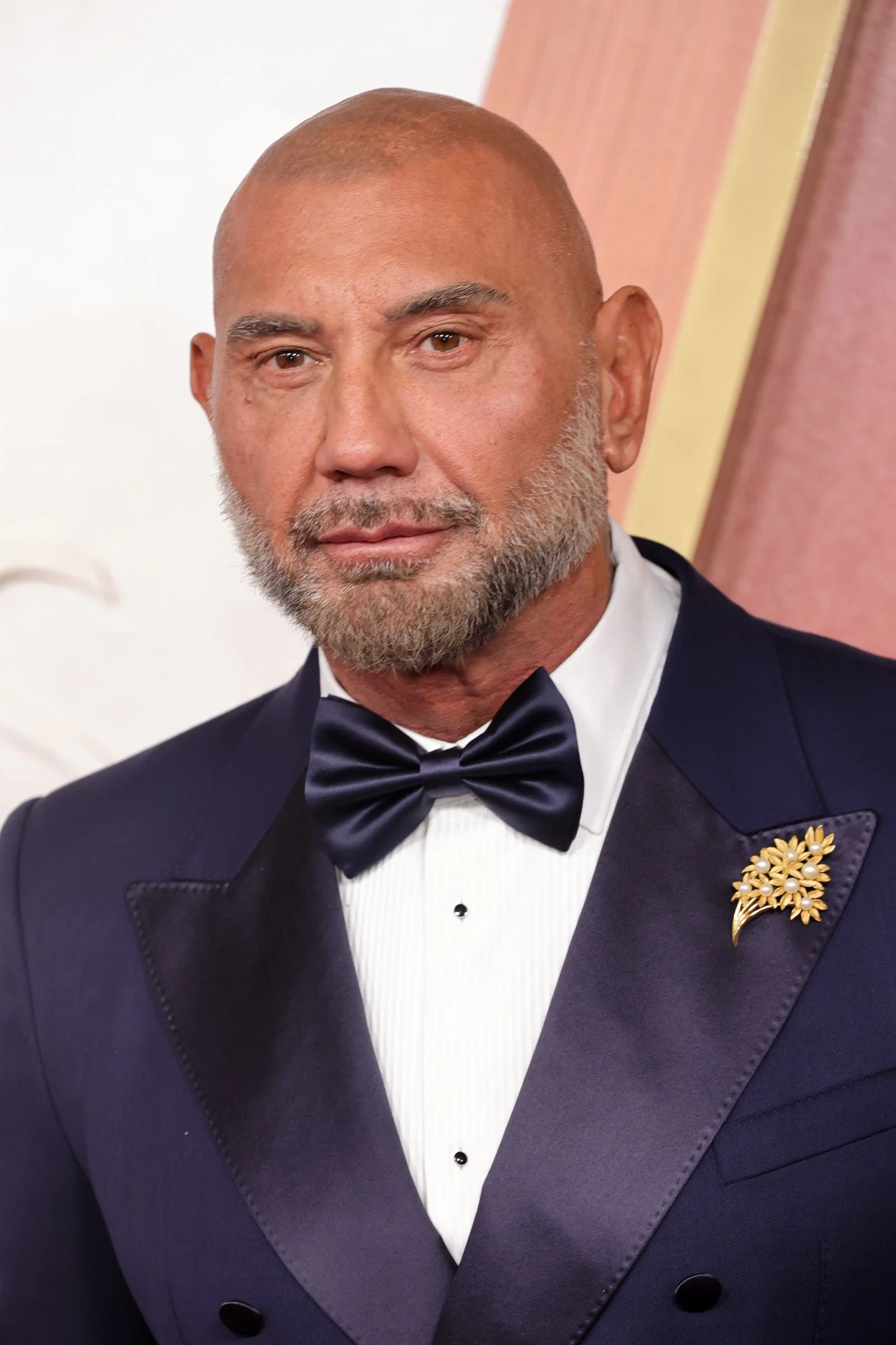 Image may contain Dave Bautista Accessories Formal Wear Tie Clothing Suit Face Head Person and Photography