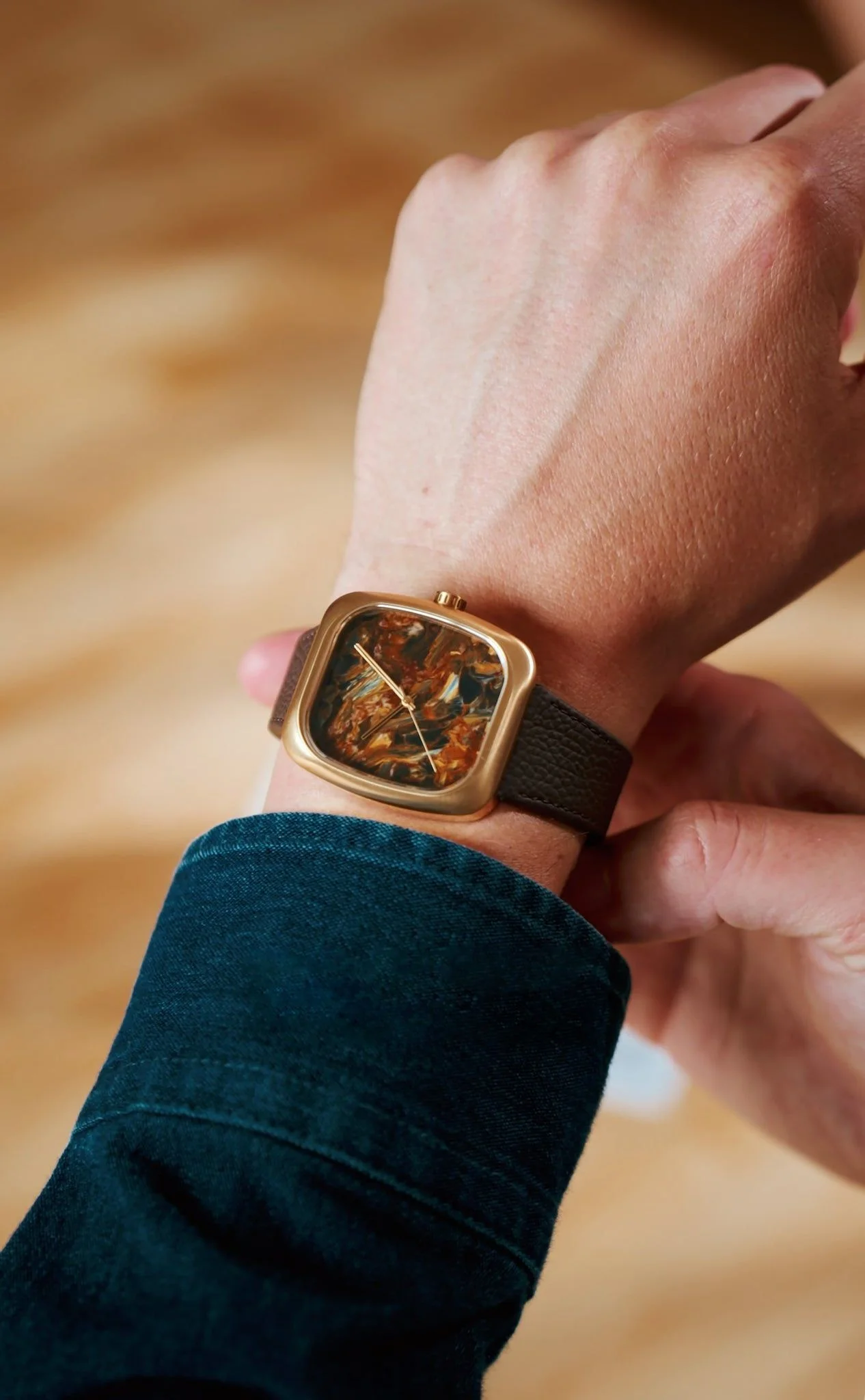 Image may contain Wristwatch Body Part Hand Person Wrist and Arm