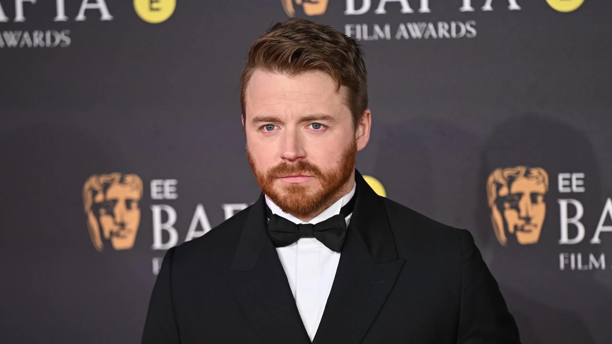 Image may contain Jack Lowden Clothing Formal Wear Suit Adult Person Accessories Tie Head Face Blonde and Hair