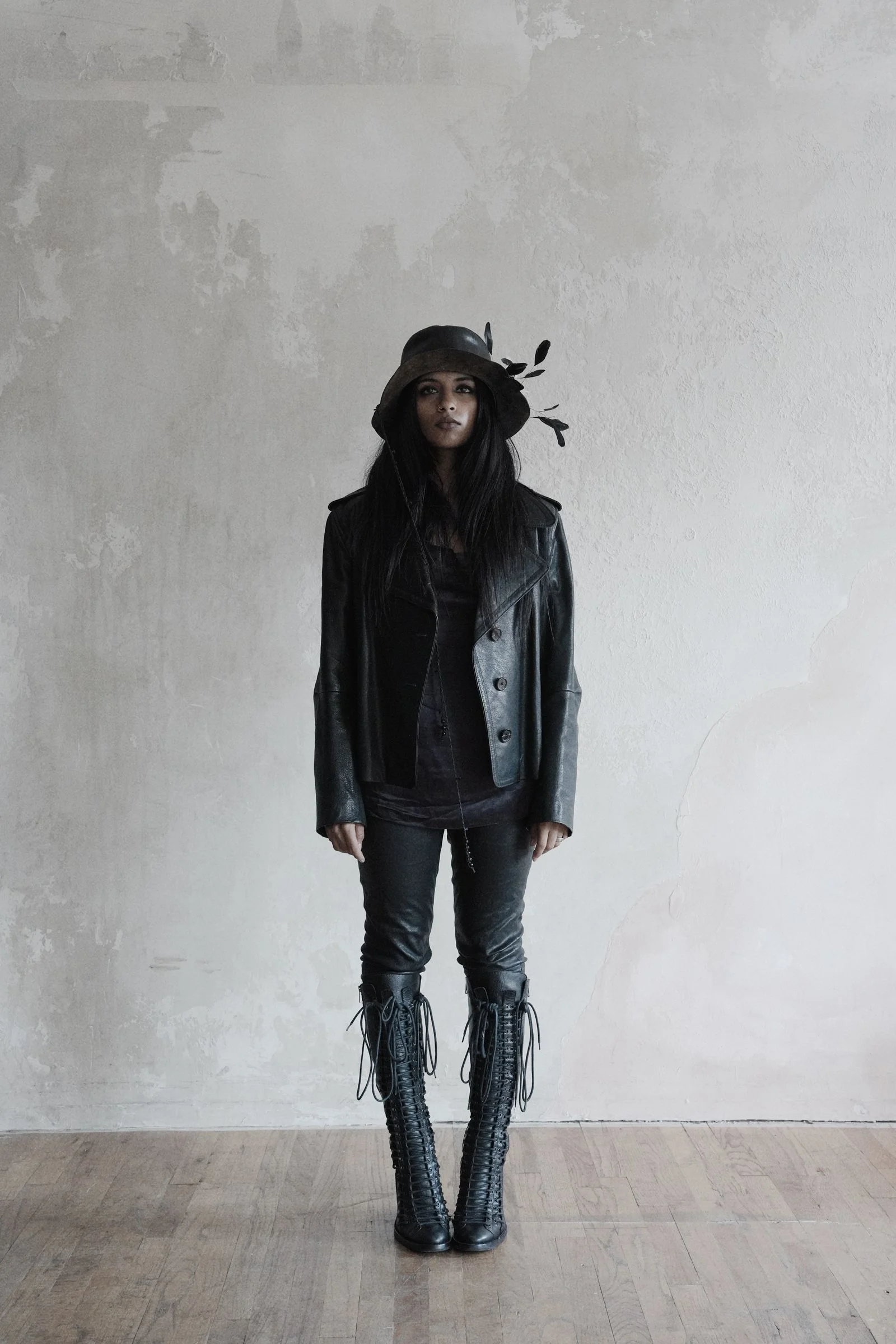 Image may contain Clothing Pants Jeans Coat Jacket Adult Person Sleeve Standing Face and Head