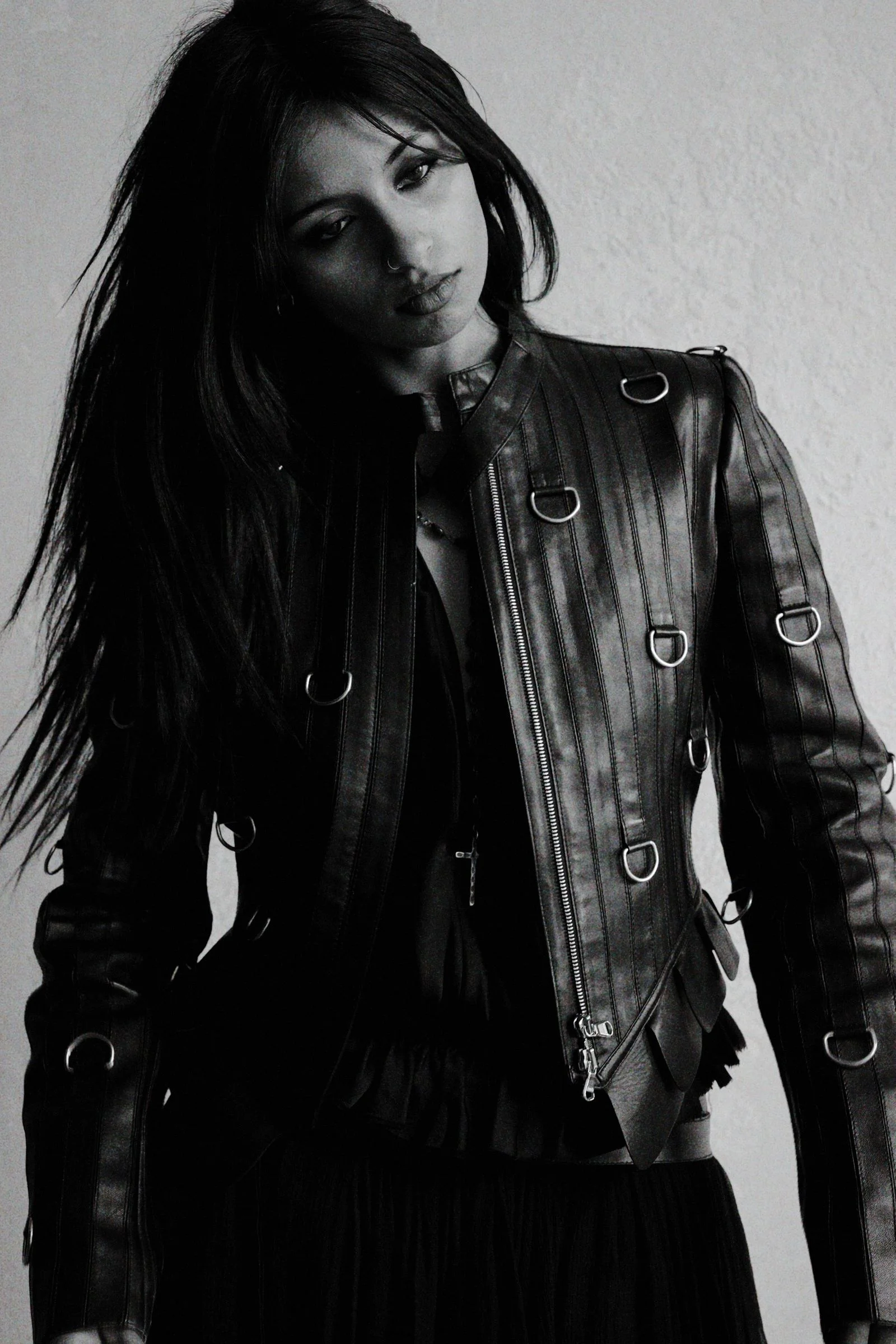Image may contain Clothing Coat Jacket Black Hair Hair Person Face Head Photography and Portrait