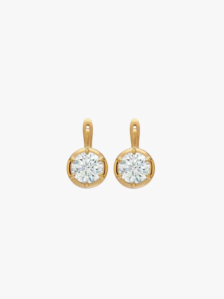 Image may contain: Accessories, Earring, Jewelry, Diamond, and Gemstone