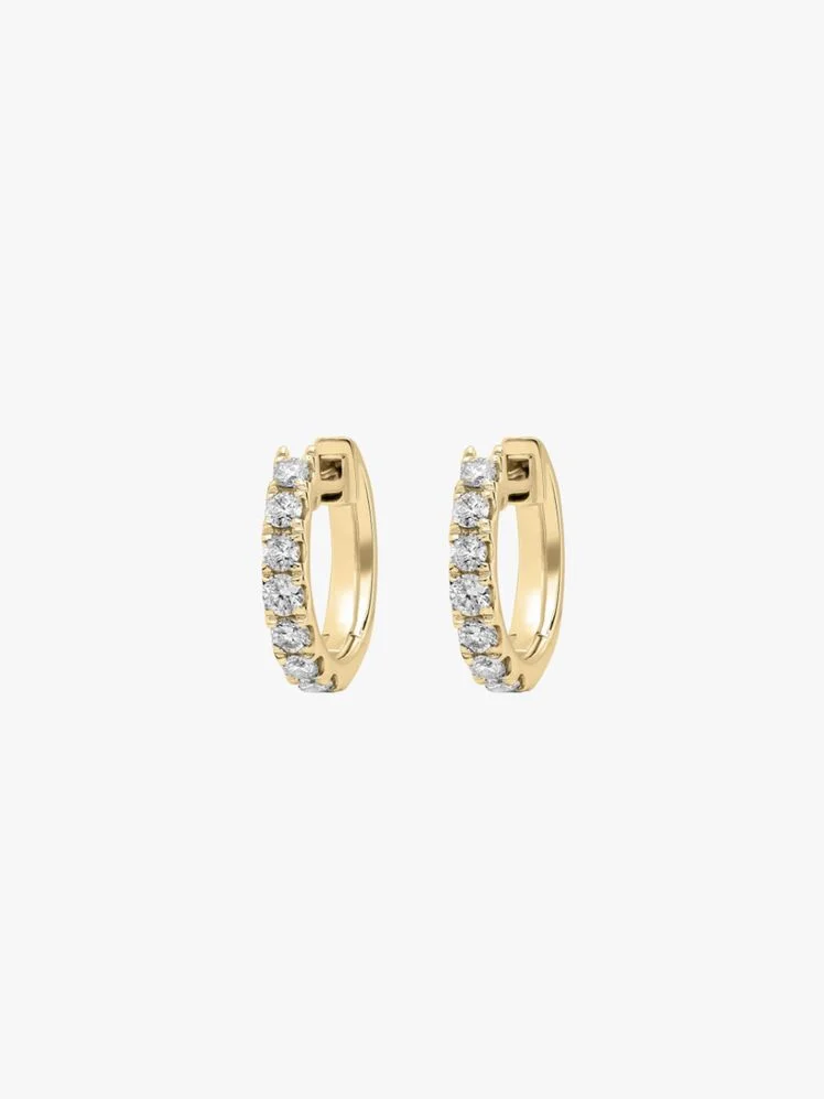 Image may contain: Accessories, Diamond, Gemstone, Jewelry, Earring, Ring, and Gold