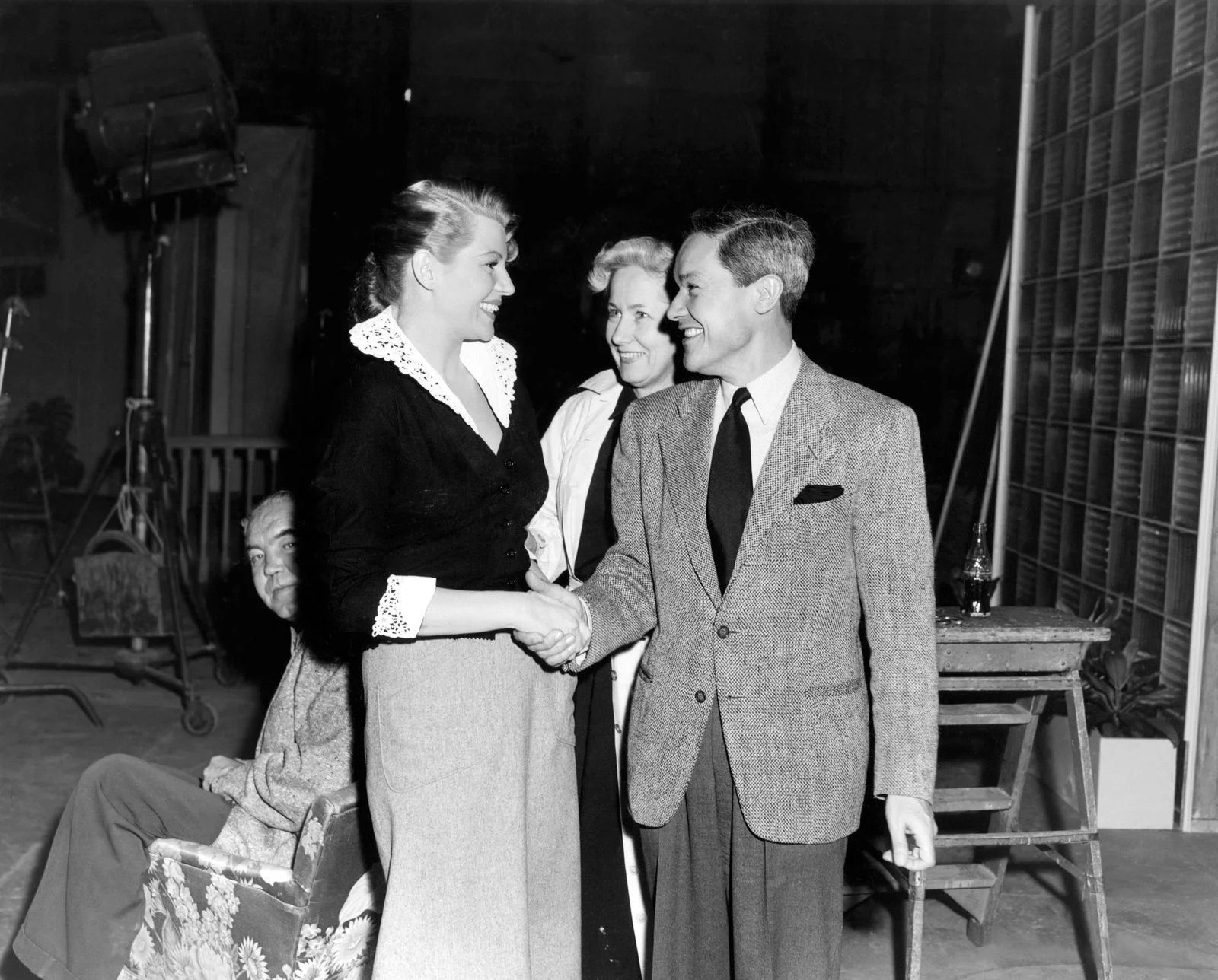 Image may contain Rita Hayworth Clothing Formal Wear Suit Coat Person Adult Wedding Body Part Hand Face and Head