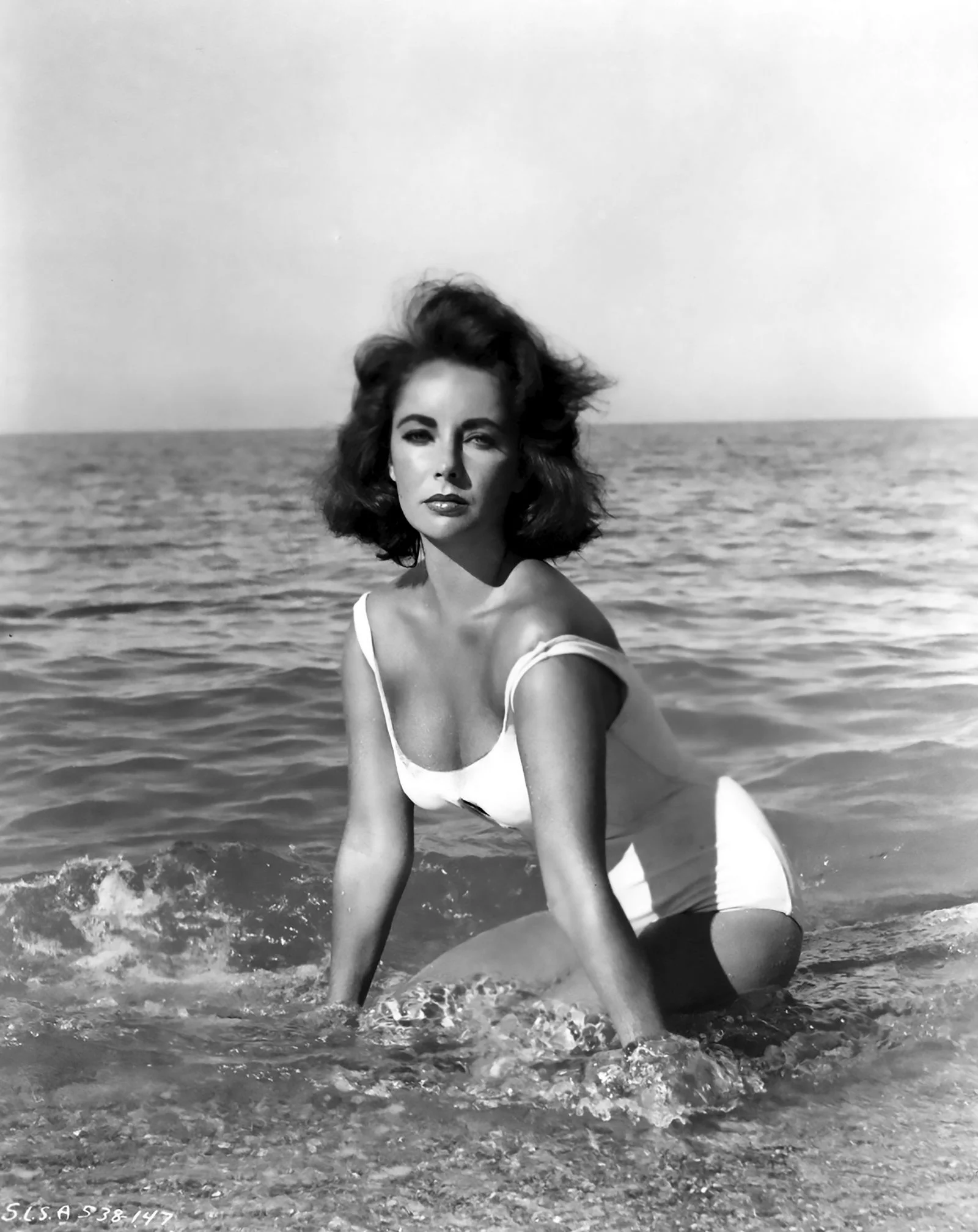 Image may contain Elizabeth Taylor Clothing Swimwear Face Head Person Photography Portrait Adult and Nature