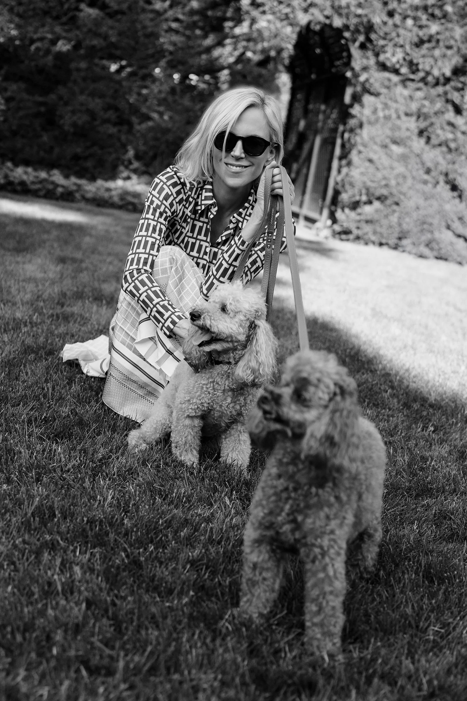 Image may contain Tory Burch Face Head Person Photography Portrait Grass Plant Accessories Sunglasses and Animal