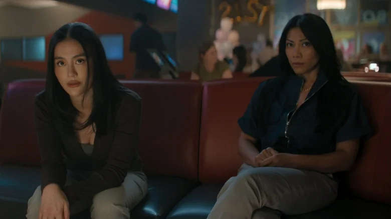 Agnez Mo's Lila Hoth and Anngun's Amisha Hoth sit side by side in a bowling alley in Reacher
