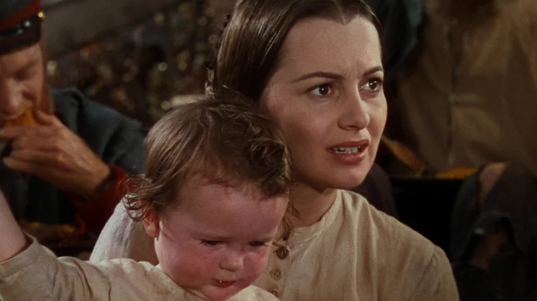Miss Melanie with a young child in Gone with the Wind