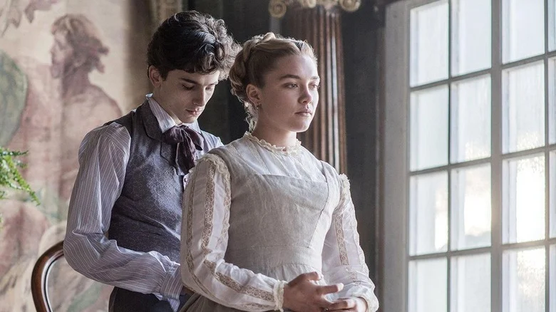 Laurie taking off Amy's apron in Little Women