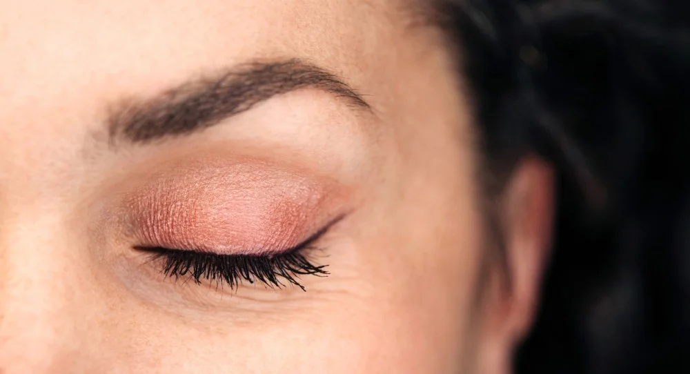A woman wearing eyeliner.